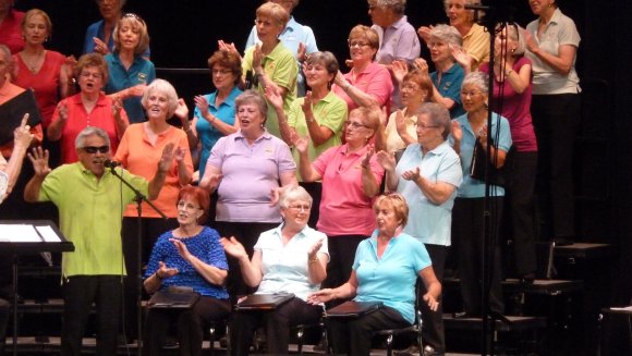 altos clapping in colored shirts